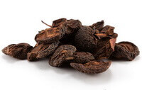 dark brownish dried herb slices of Fructus Crataegi Preparatus are piled together