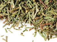 dried pale greenish leaves of Chinese Arborvitae Twig and Leaf are piled together